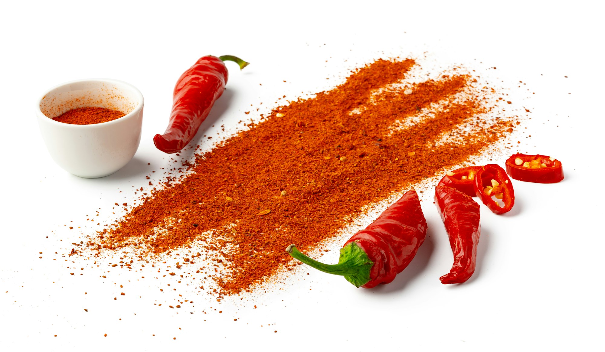 Pile of red paprika powder isolated on white background